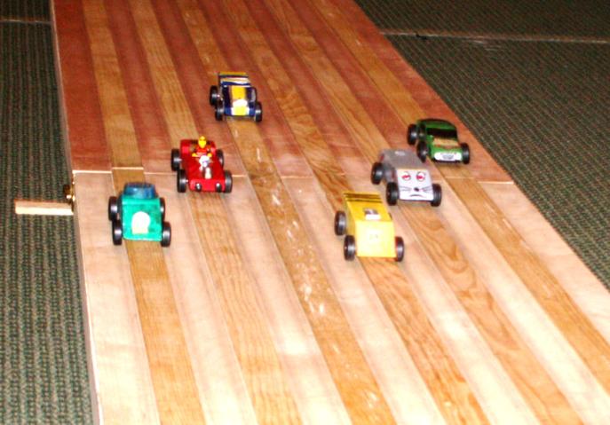 The cars go down the track