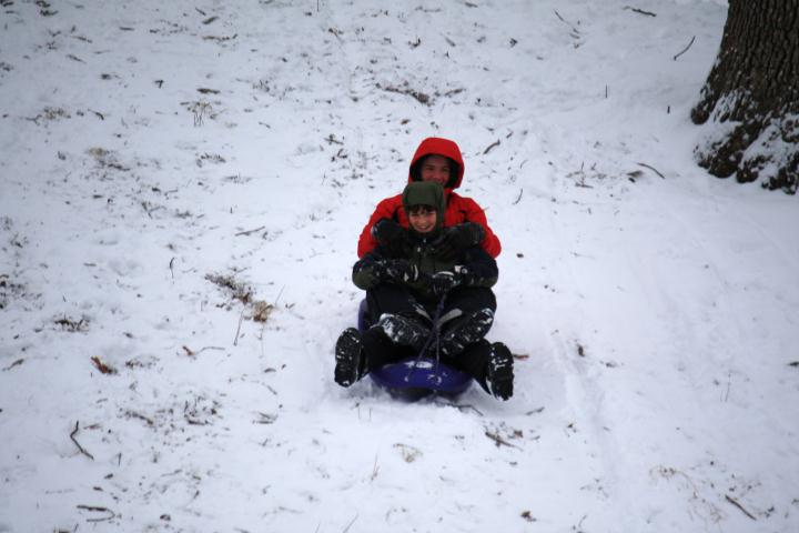 sledding at the local golf course