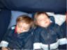 Boys asleep on the train
