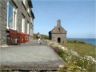 Robert chases a bird in front of St. Nons chapel