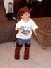 Jonathan tries on Sheila's boots and hat