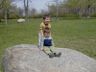 Jonathan helps Robert slide down a rock.