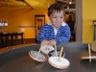 Jonathan plays with tops at the Children's museum