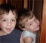 Jonathan and Robert squeeze between the wardrobe and the wall