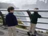 Robert peeks at Niagara Falls.  Jonathan looks on