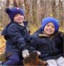 Robert and Jonathan sit on a log