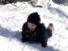 Robert lies in the snow