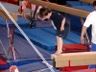 Robert balances n the beam and preparesto dismount