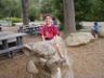 Jonathan climbs on the tiger statue