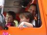 Jonathan, Robert and Nancy in the cab of an 18-wheeler