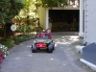 Jonathan drives down the driveway in his Jeep.