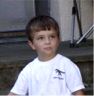 Robert sits on the front steps