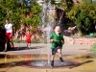 Jonathan runs through a fountain