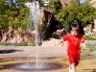 Robert runs through a fountain