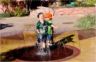 Jonathan meets a boy named 'Che'and they play in the fountain