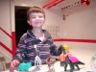 Robert makes play-do clothes for the dinosaurs