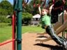 Jonathan does the monkey bars at Fox Meadow