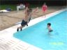 Robert jumps in the pool